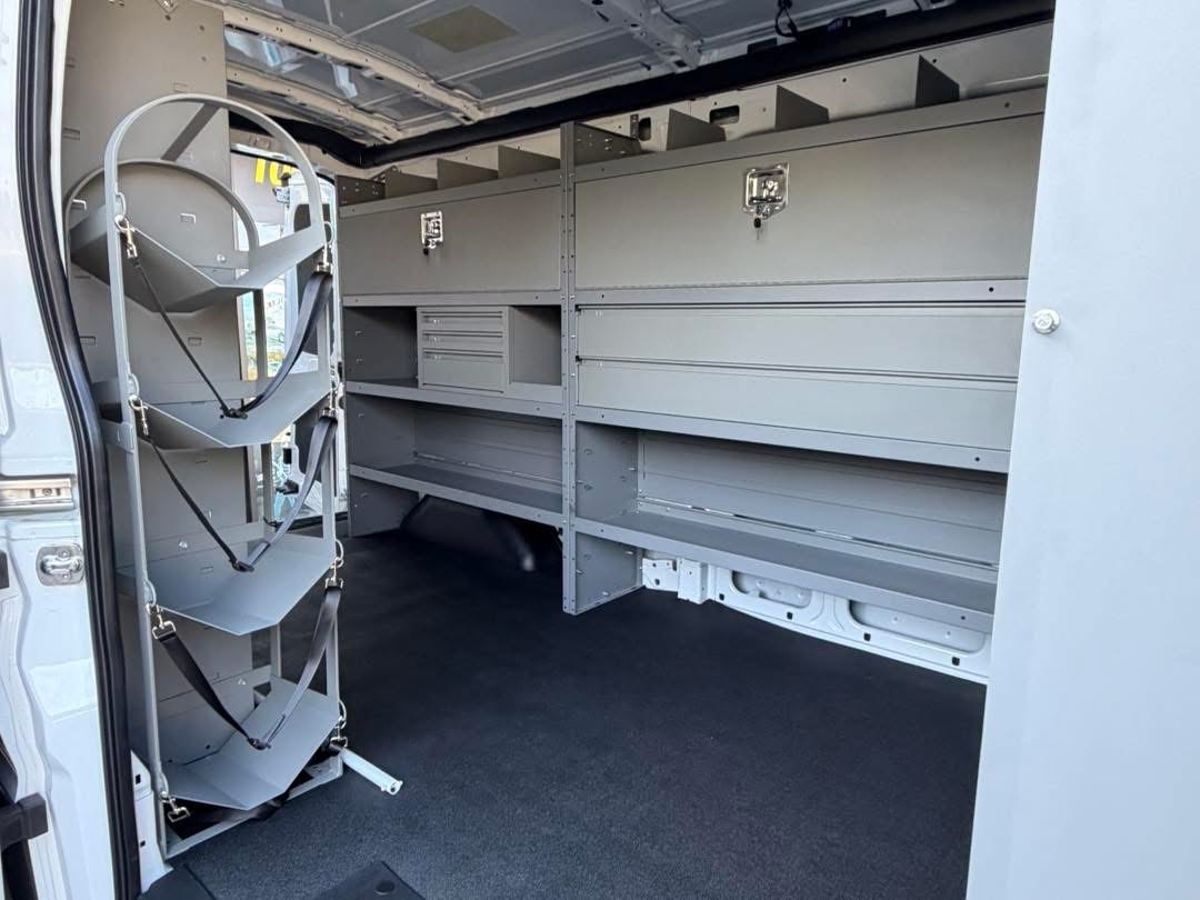 Commercial van shelving with equipment storage along the side wall