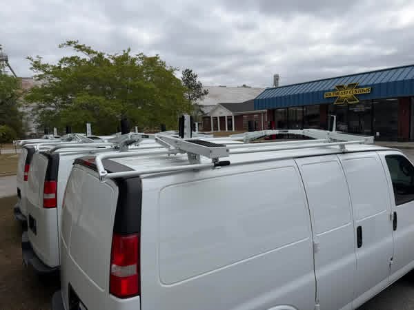 Commercial vans with roof-mounted ladder racks