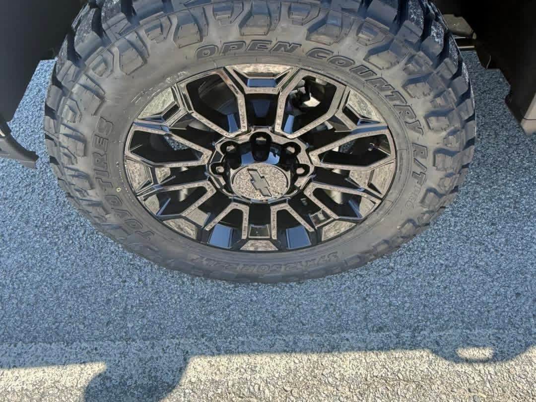 Close view of a Chevrolet wheel and Toyo Open Country tire